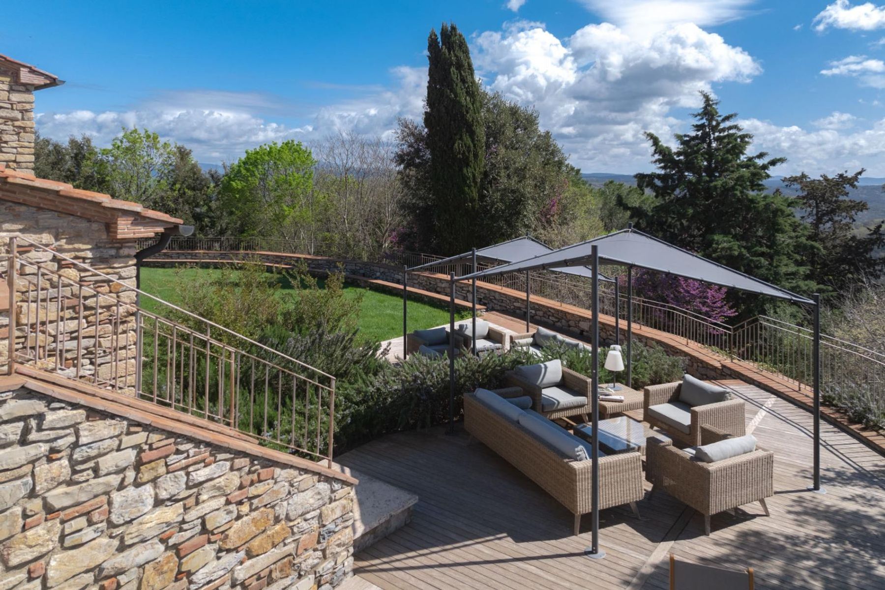 Admire the sweeping scenic views from the outdoor lounge area, perfectly shaded by a gazebo. 