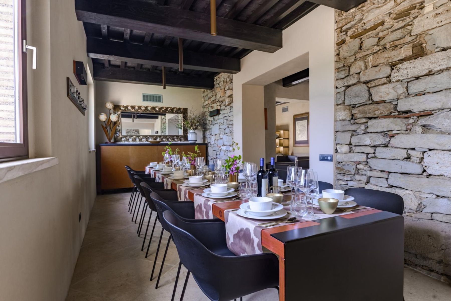 A stylish dining room is adjacent to the fully equipped contemporary kitchen is perfect for guests, and seats up to fourteen guests.