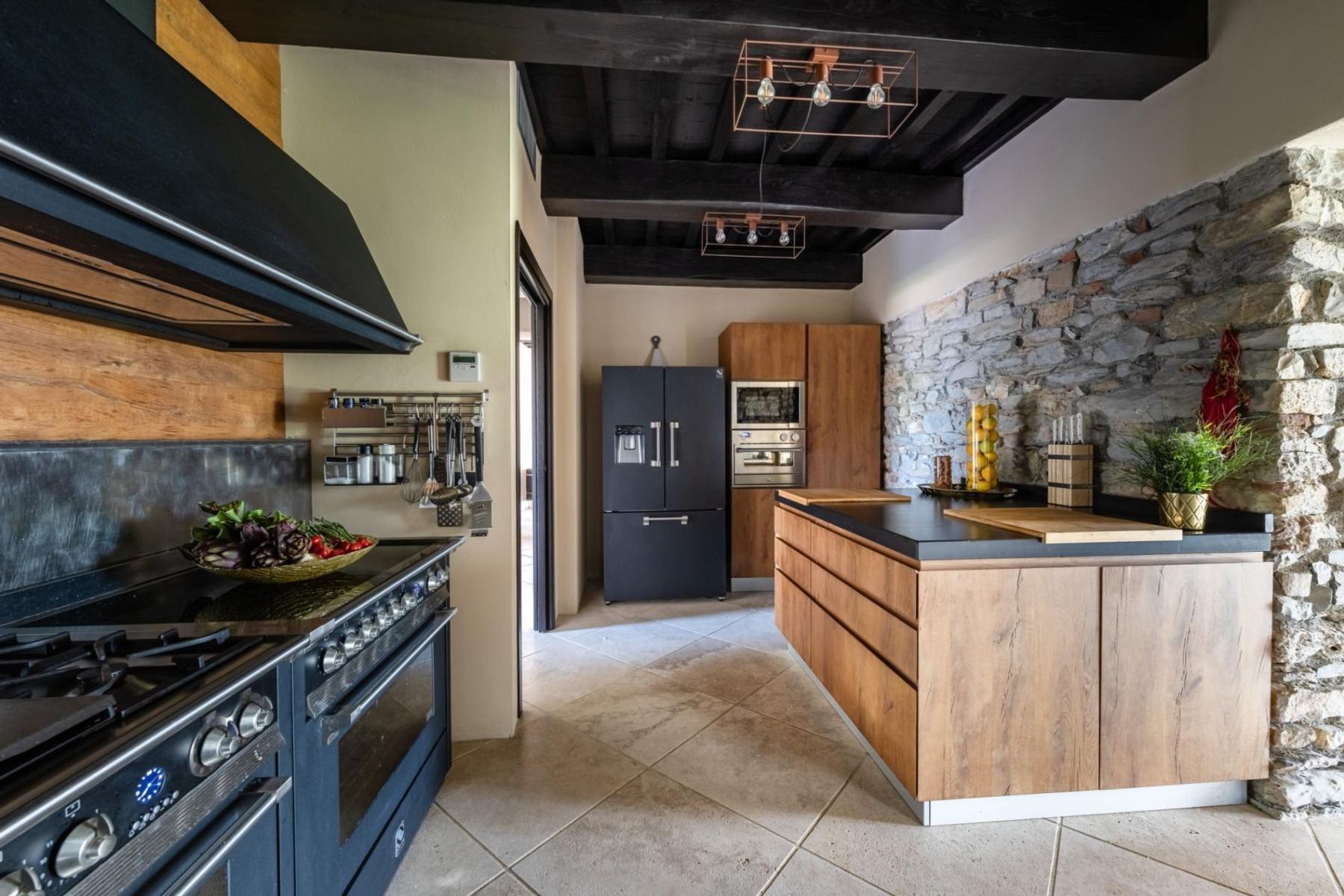 Fully-equipped contemporary kitchen with modern appliances and island.