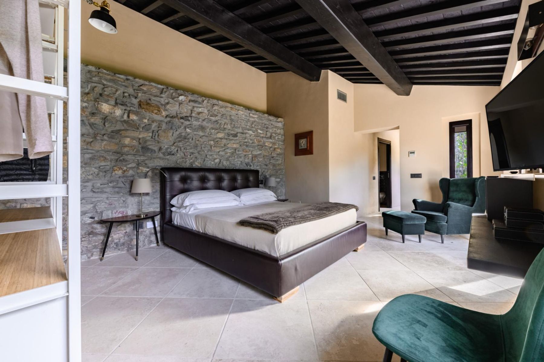 Spacious double ensuite bedroom with smart television, and charming original features.