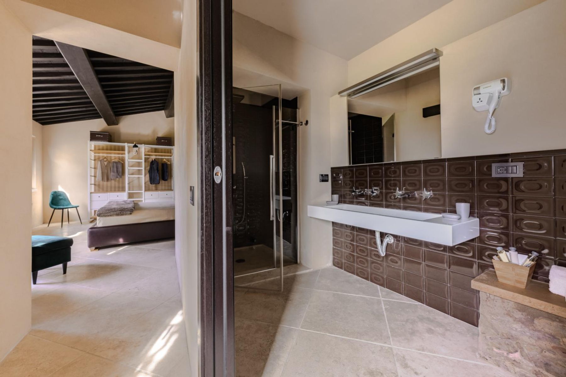 Modern ensuite bathroom with double basin, and walk-in shower.