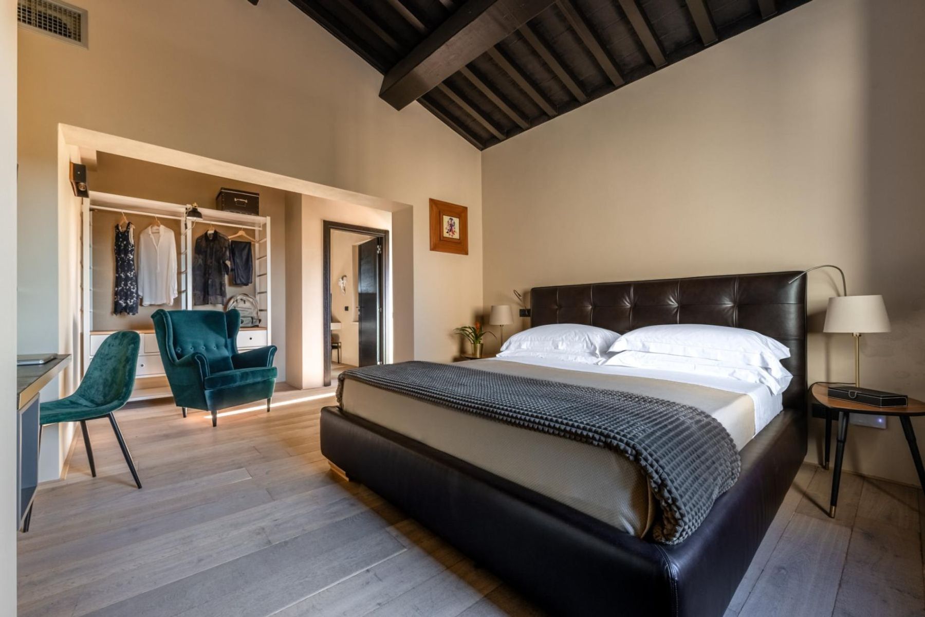 Double ensuite bedroom, with stylish plush furnishings, and smart television.