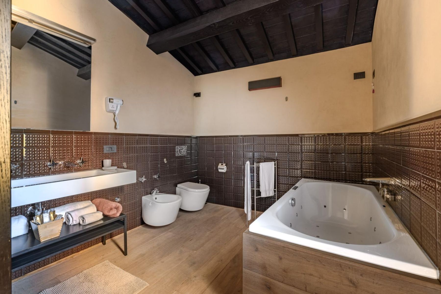 Spa-inspired ensuite bathroom with jacuzzi bath-tub, separate shower, and double basin.