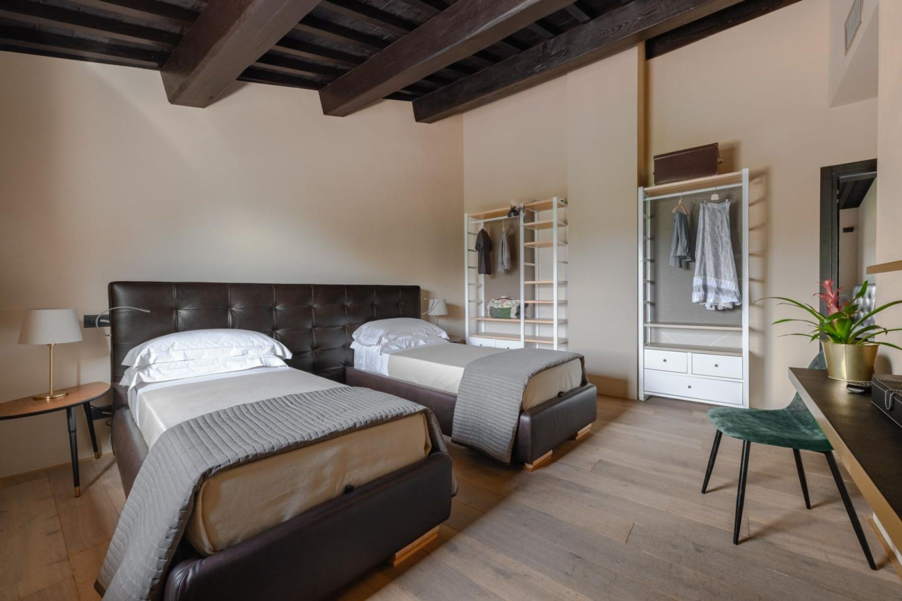 Twin ensuite bedroom with air-conditioning and smart television.