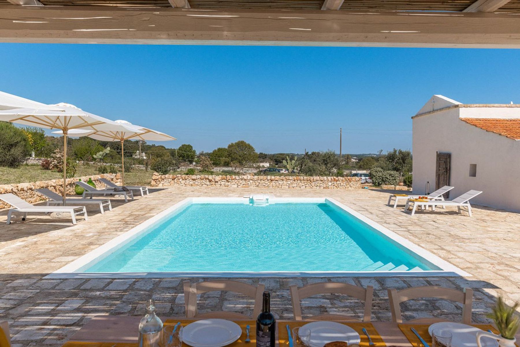 Dine alfresco under the charming pergola, after a morning of splashing around in the private pool.