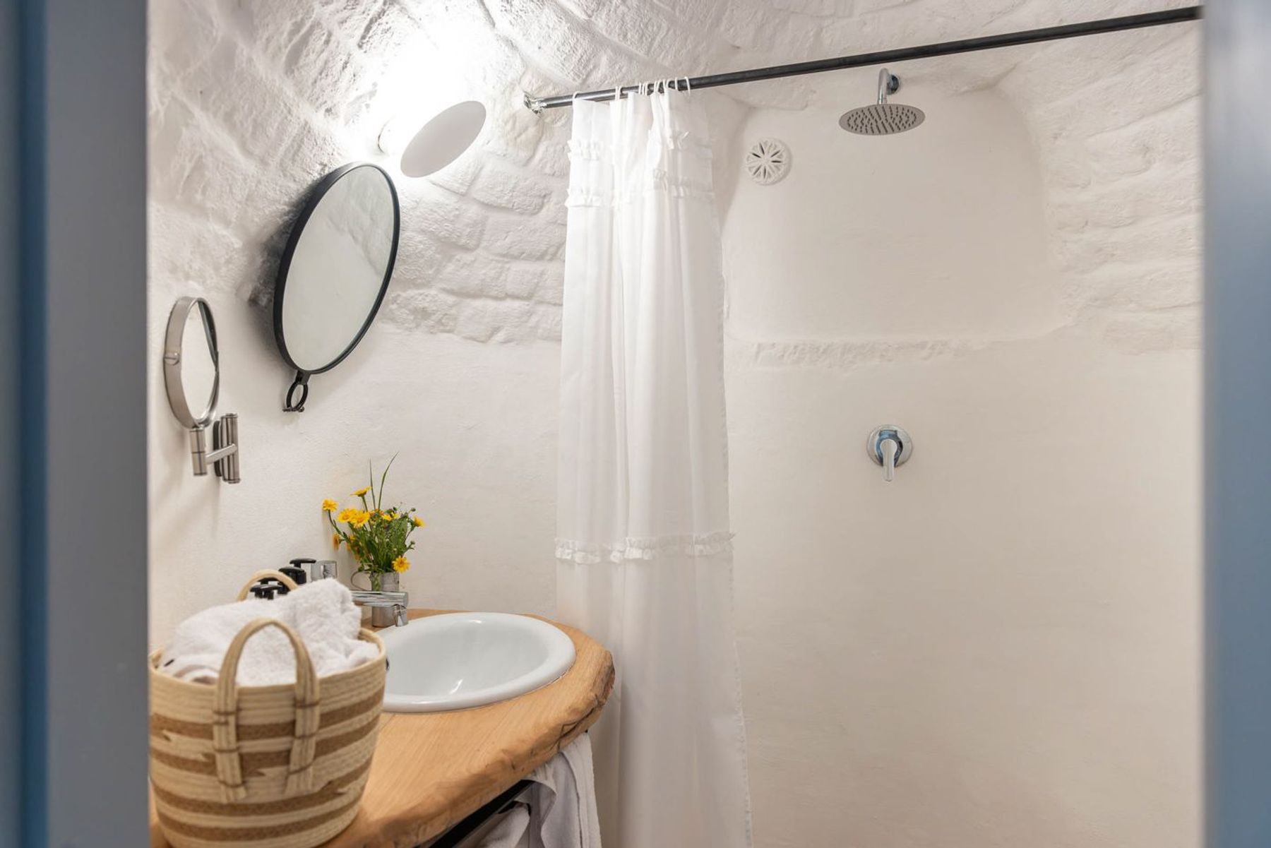 Ensuite bathroom with walk-in shower, toiletries and hair dryer.