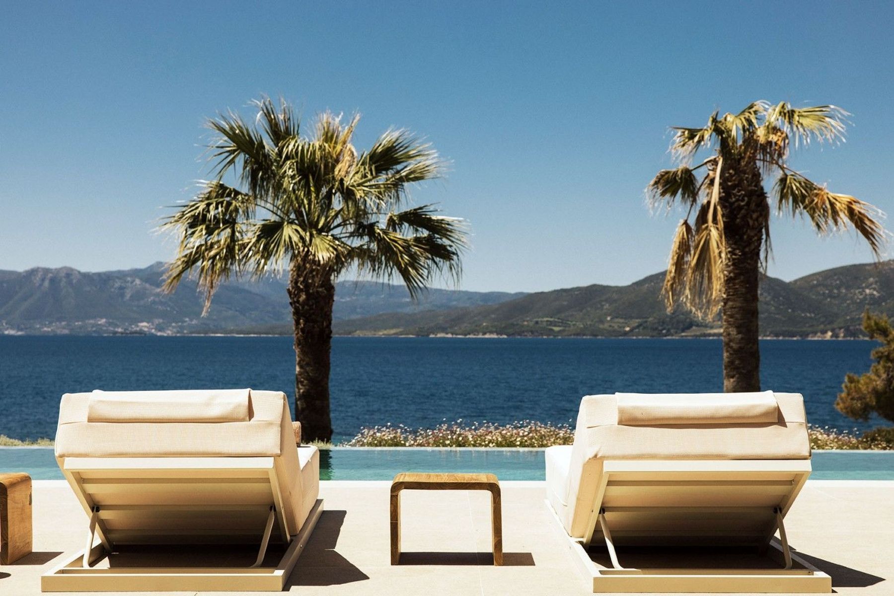 Choose your favourite plush lounger, and take in those stunning sea views. This poolside retreat is ideal for unwinding under the Mediterranean sun.