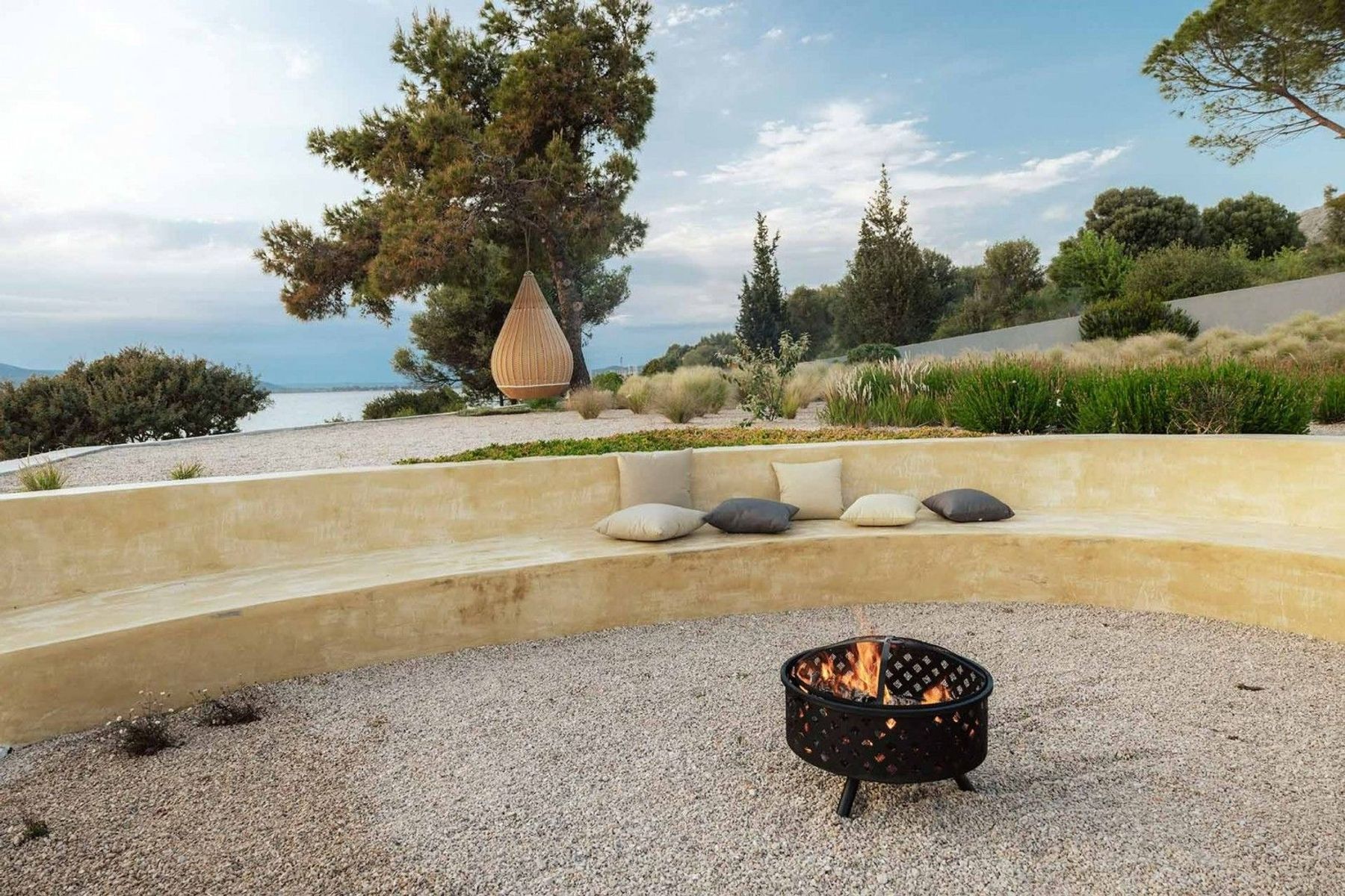 Make memories in the circular seating area surrounding the fire pit, and looking out to sea.