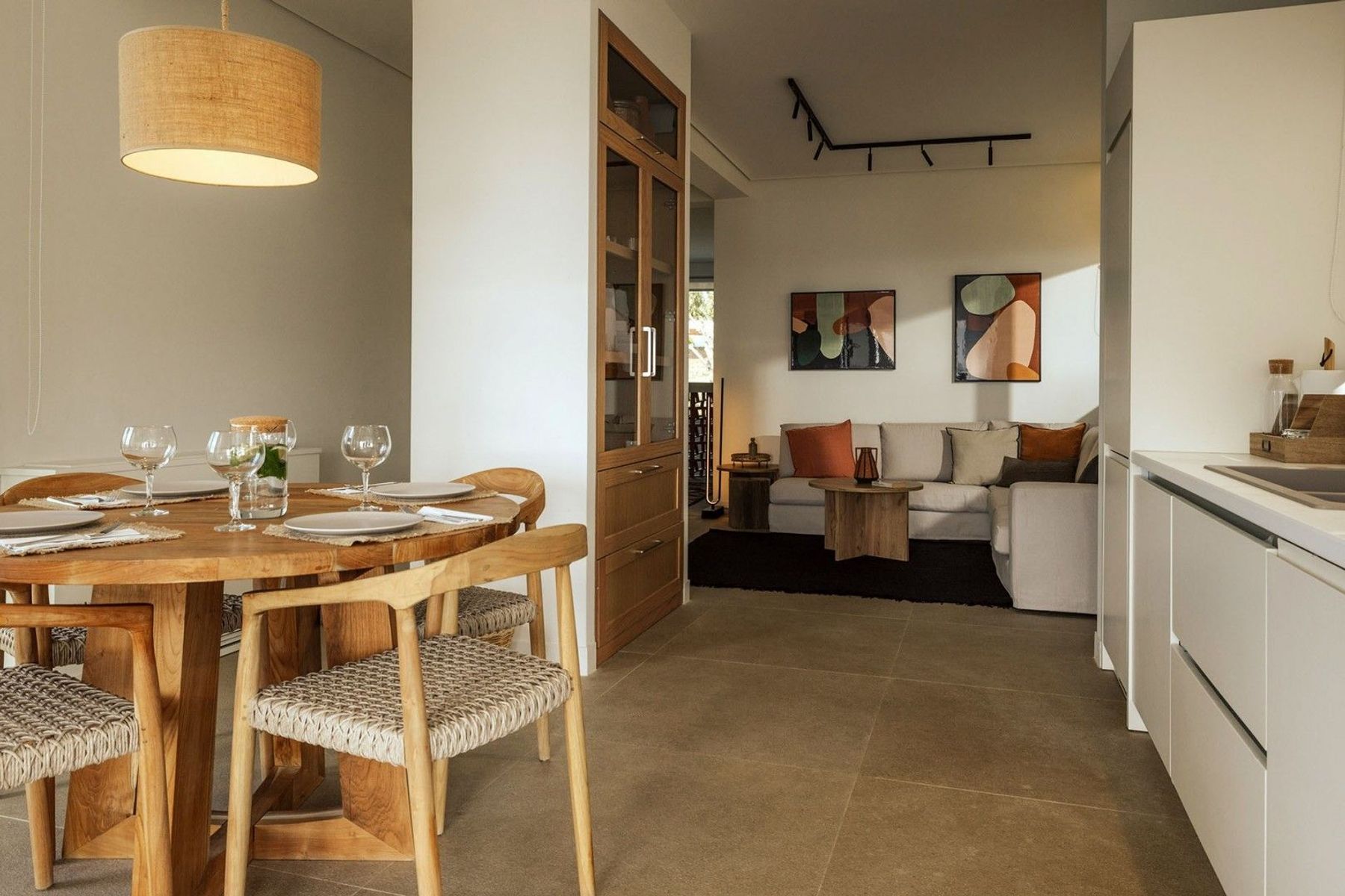Open-plan living on the third floor with a fully-equipped kitchen and dining area.