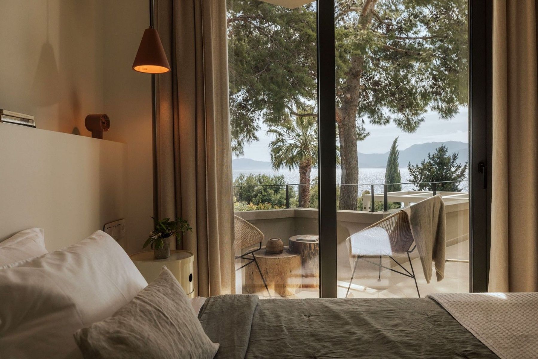 Double ensuite bedroom with balcony access and superb sea views.