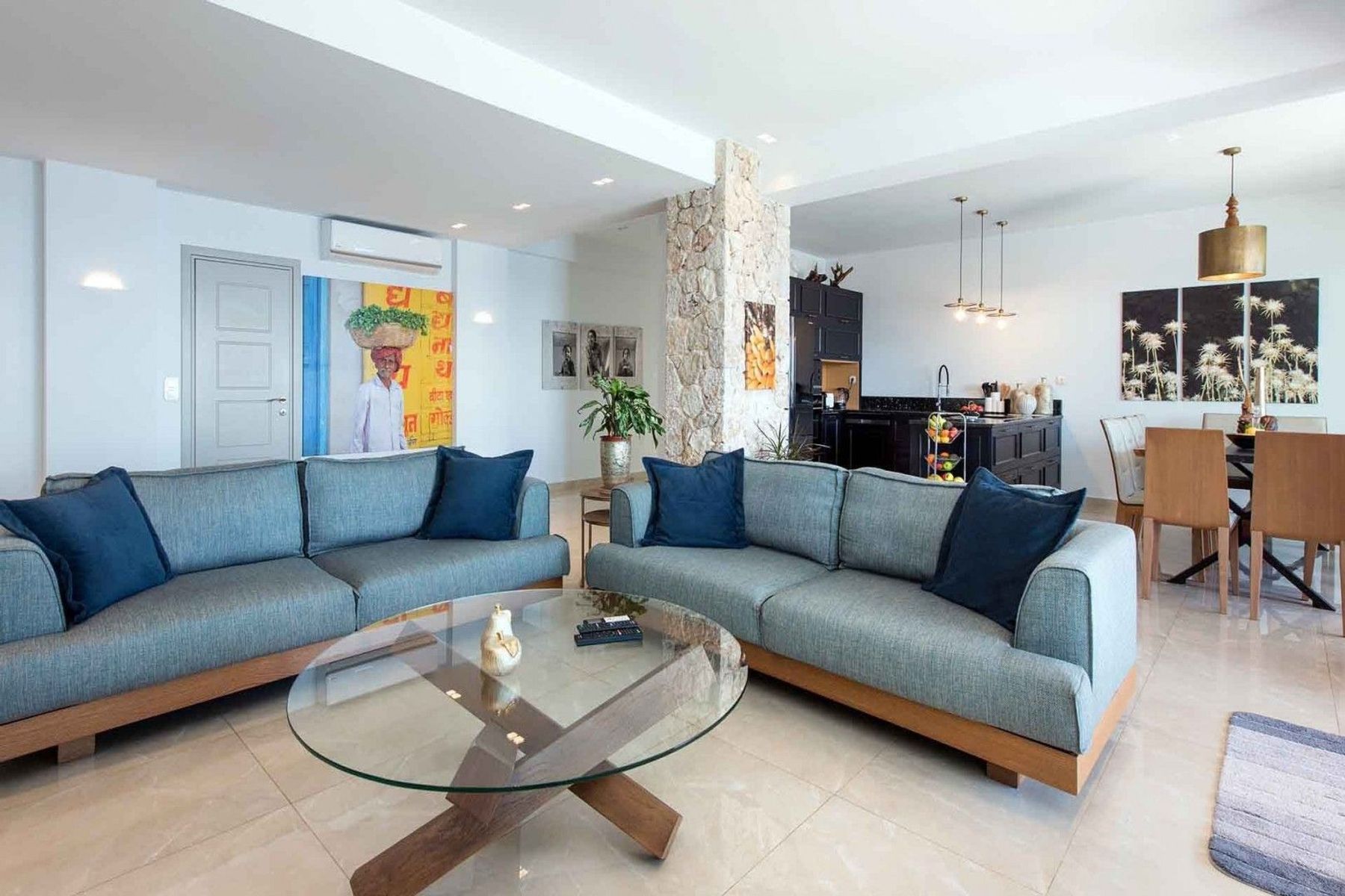 Bright open-plan living area with comfortable sofas.