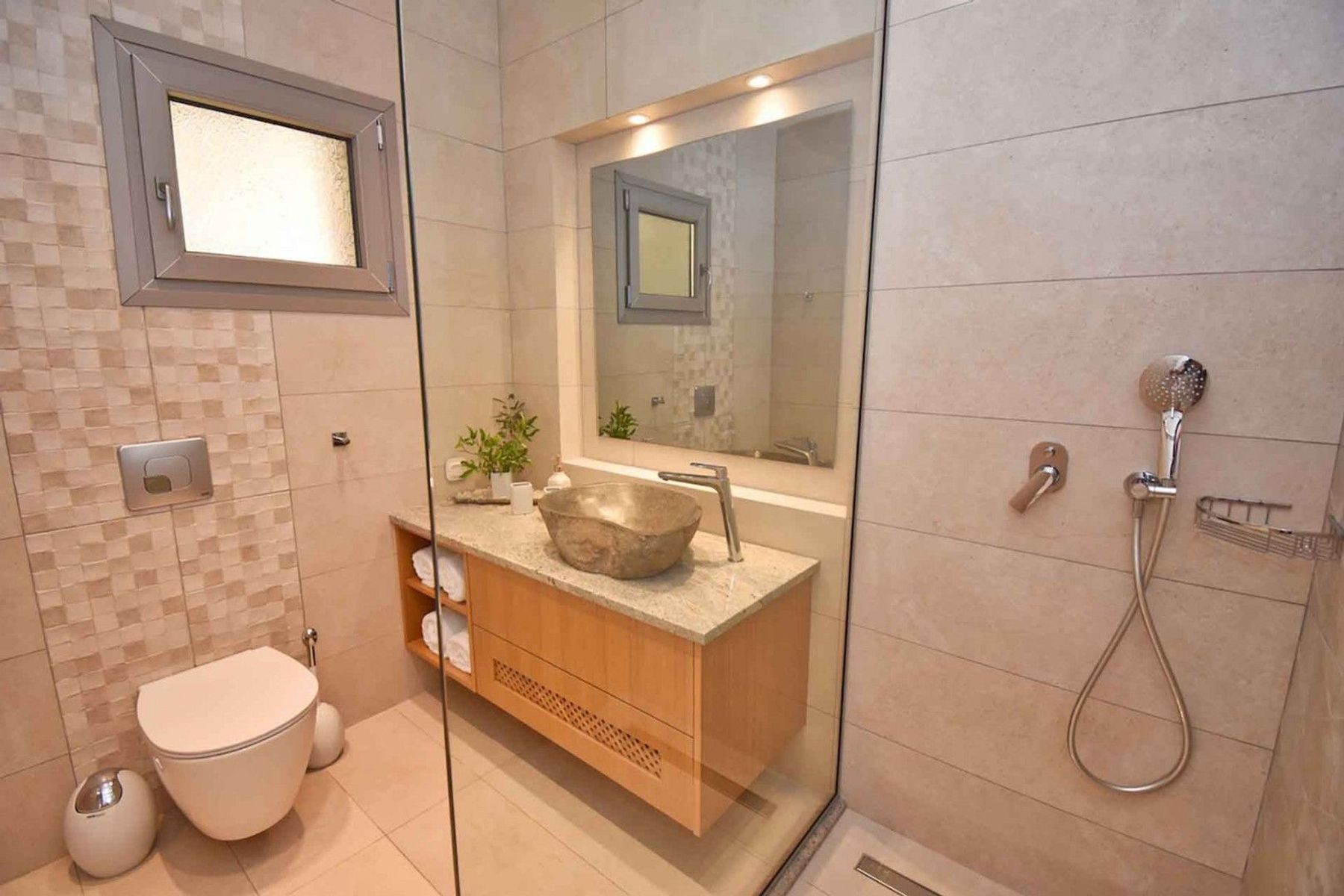 Modern ensuite bathroom, with walk-in shower, and contemporary basin and vanity. 