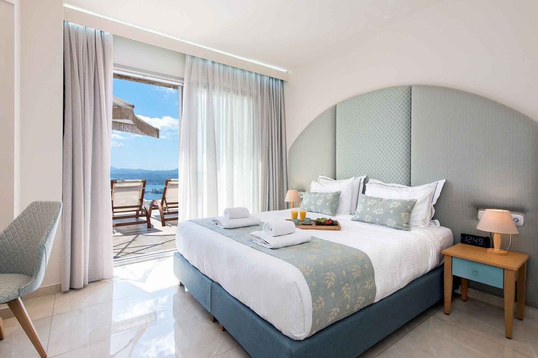 Double ensuite bedroom with air-conditioning and access to the pool deck.