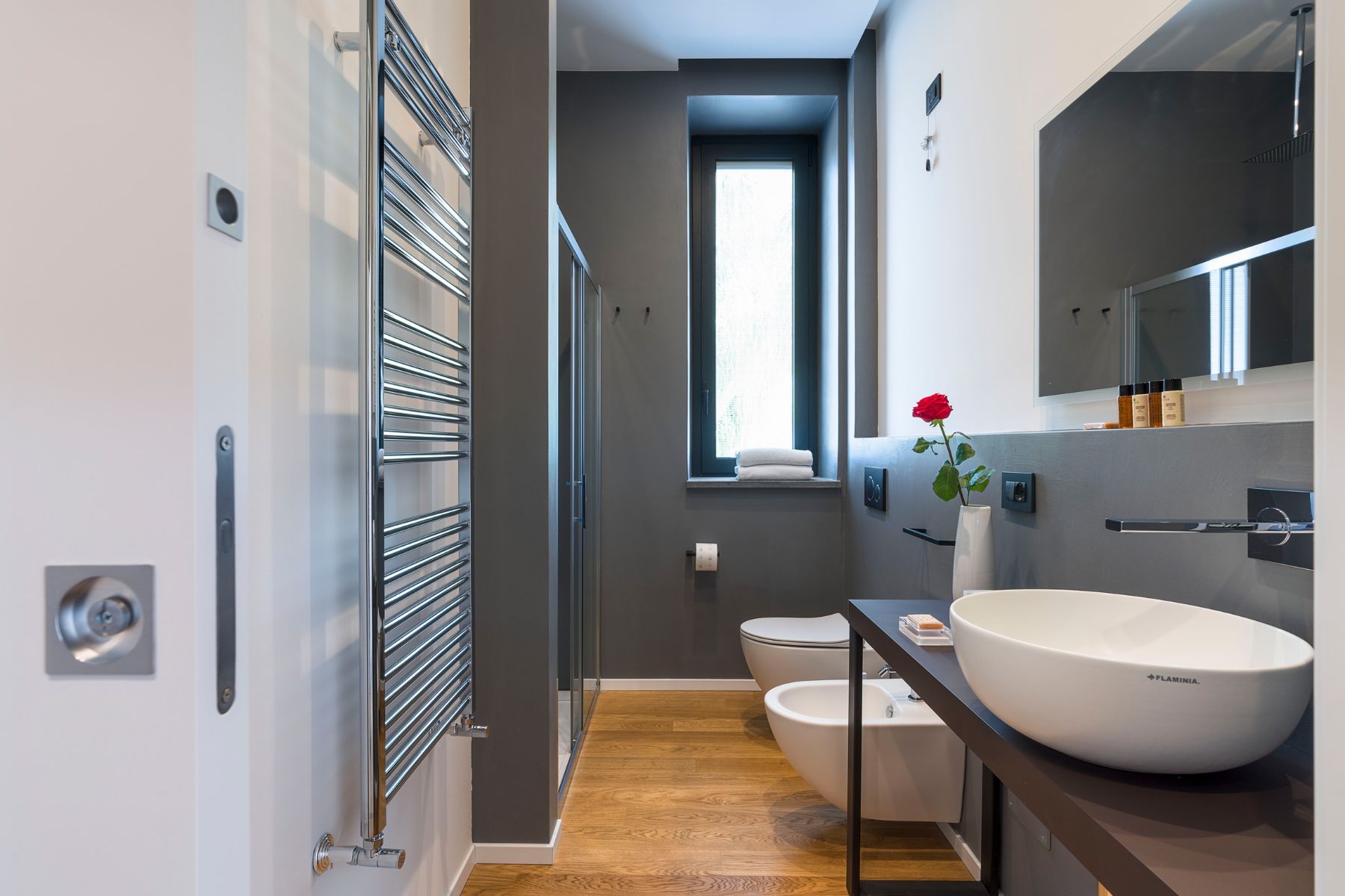 Spa-like ensuite bathroom, with walk-in shower, and modern basin.