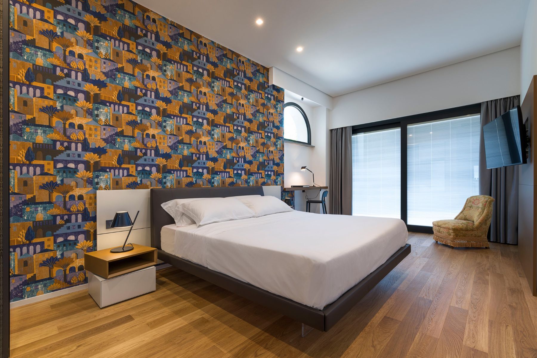 Double ensuite bedroom, with television, desk area and modern interiors. 