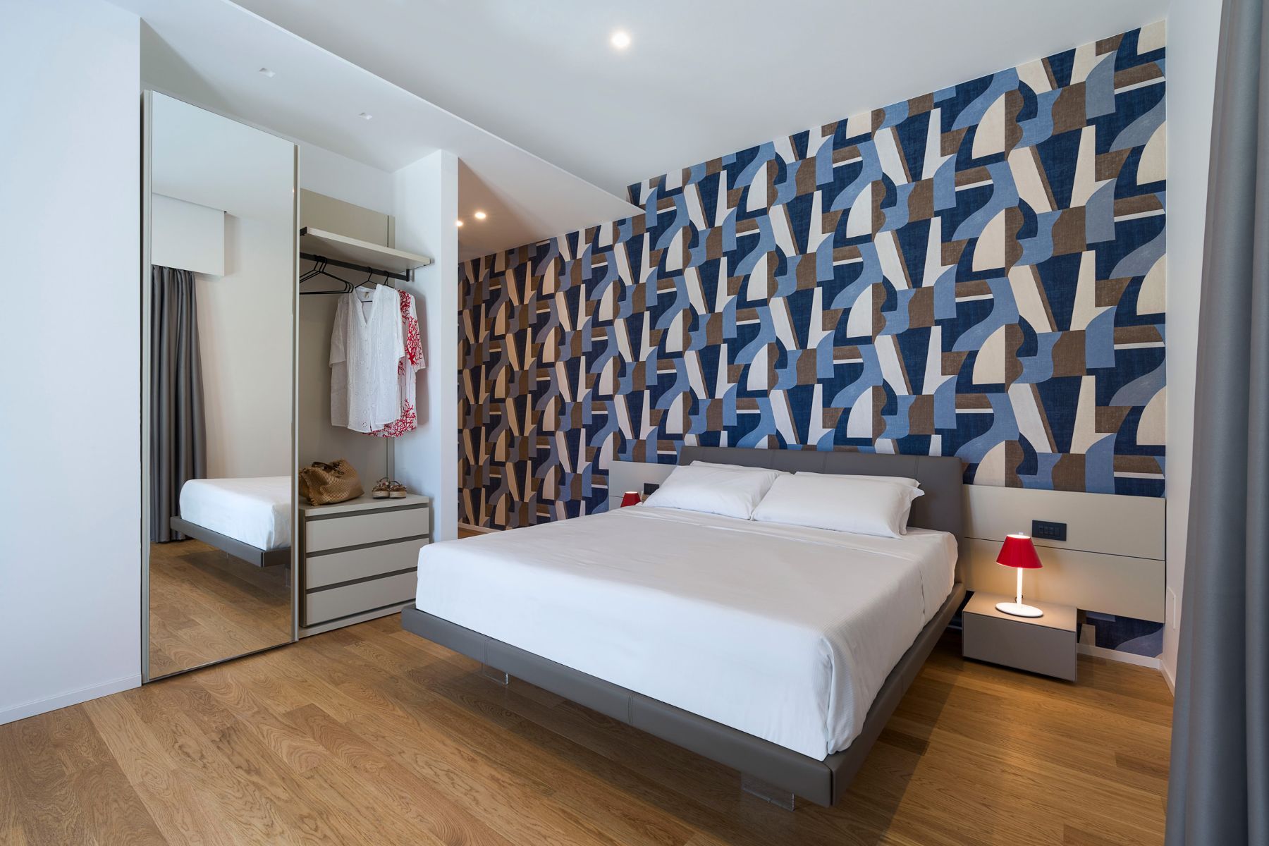 Double ensuite bedroom, with modern interiors, and wooden flooring.