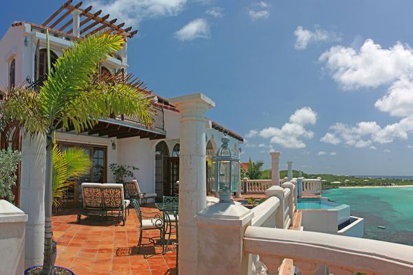 Azure villa sits above the Caribbean shoreline just minutes from Shoal Bay Beach 