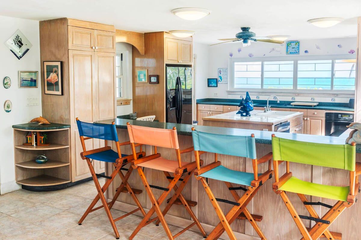 Kitchen has a breakfast bar that seats four