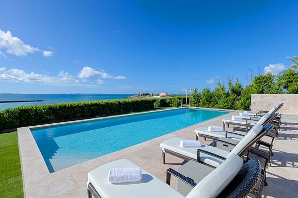 Lounge by the pool and enjoy amazing ocean views at Beaches Edge East Villa