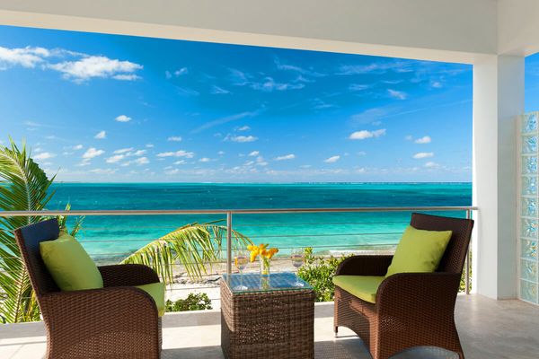 Endless Caribbean views form the patio balcony at Sea Edge Villa