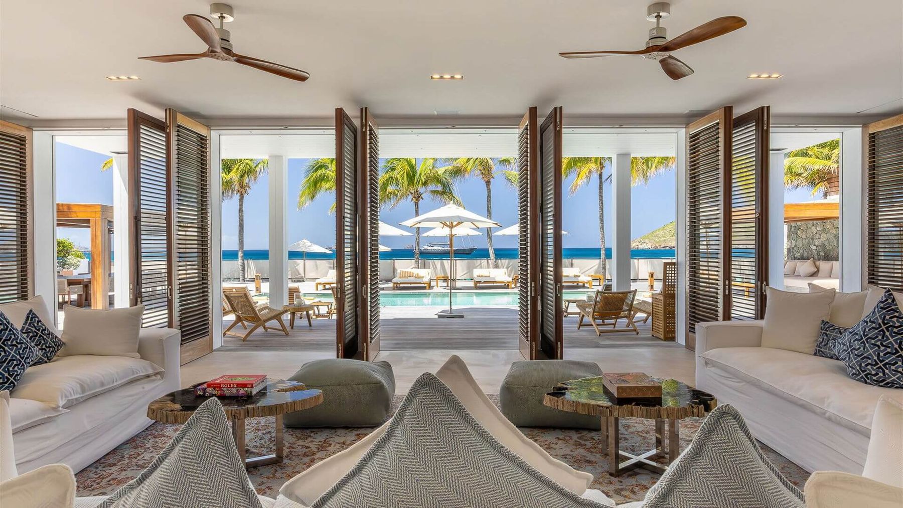Open living area with floor to ceiling windows