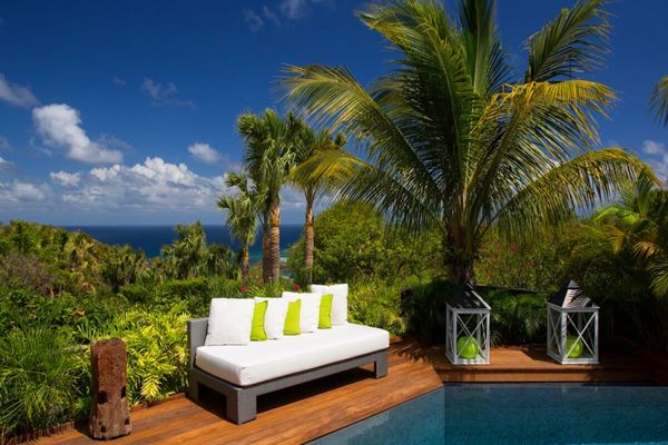 Enjoy views of Marigot Bay in the distance from the pool deck at Carmen Villa