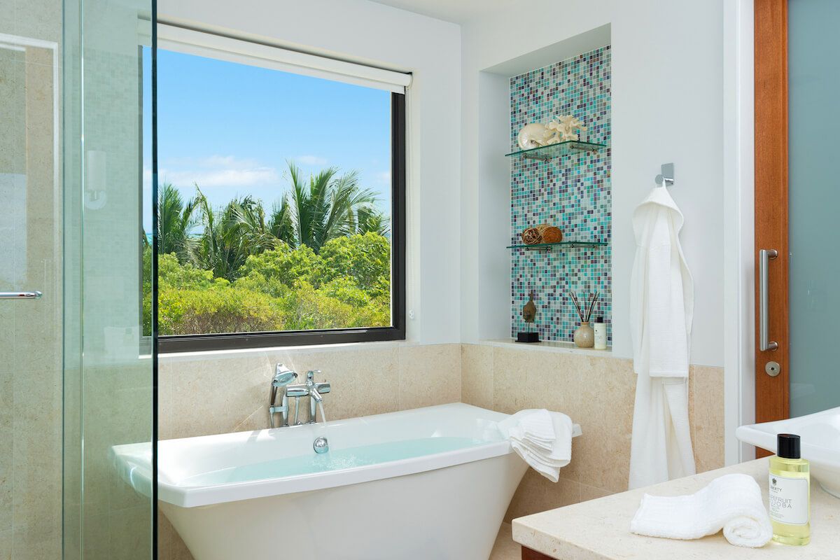 En suite bathroom with a bath tub