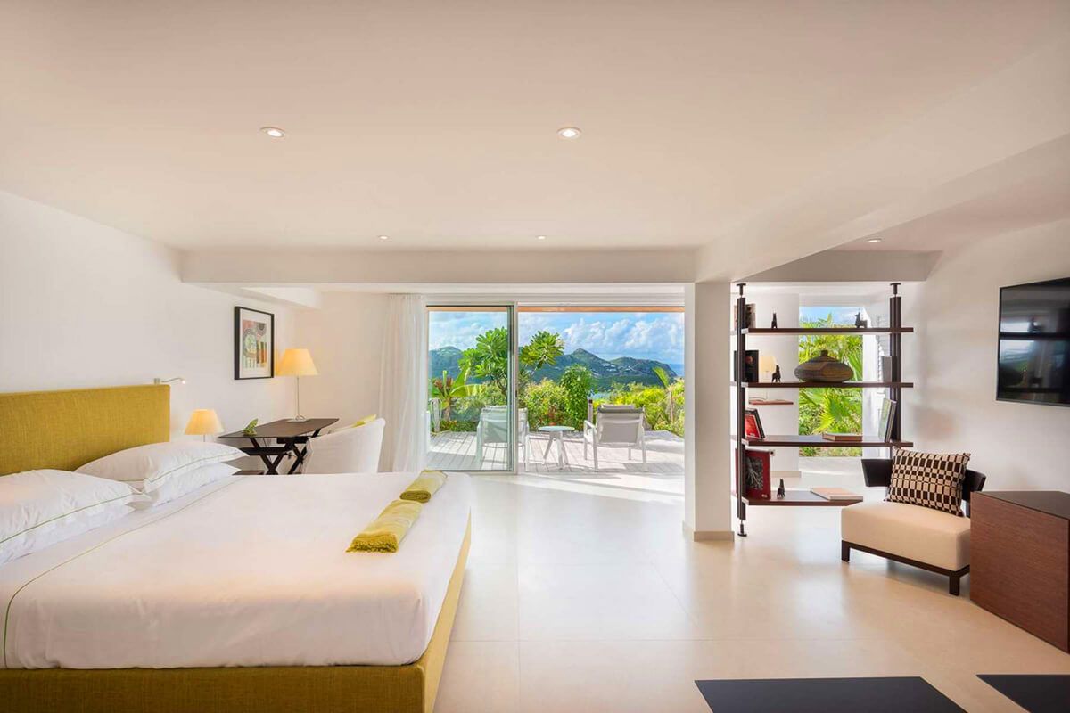 Master bedroom with sitting area and patio access on the upper level
