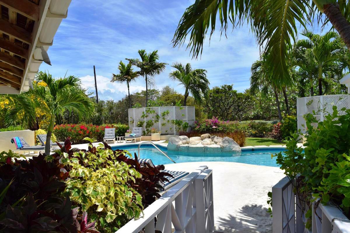 A bridge goes out to the pool area