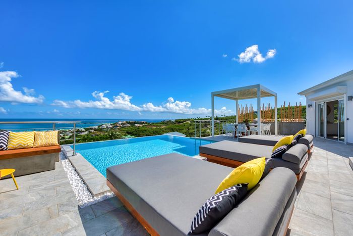 Lounge by the pool overlooking Orient Beach
