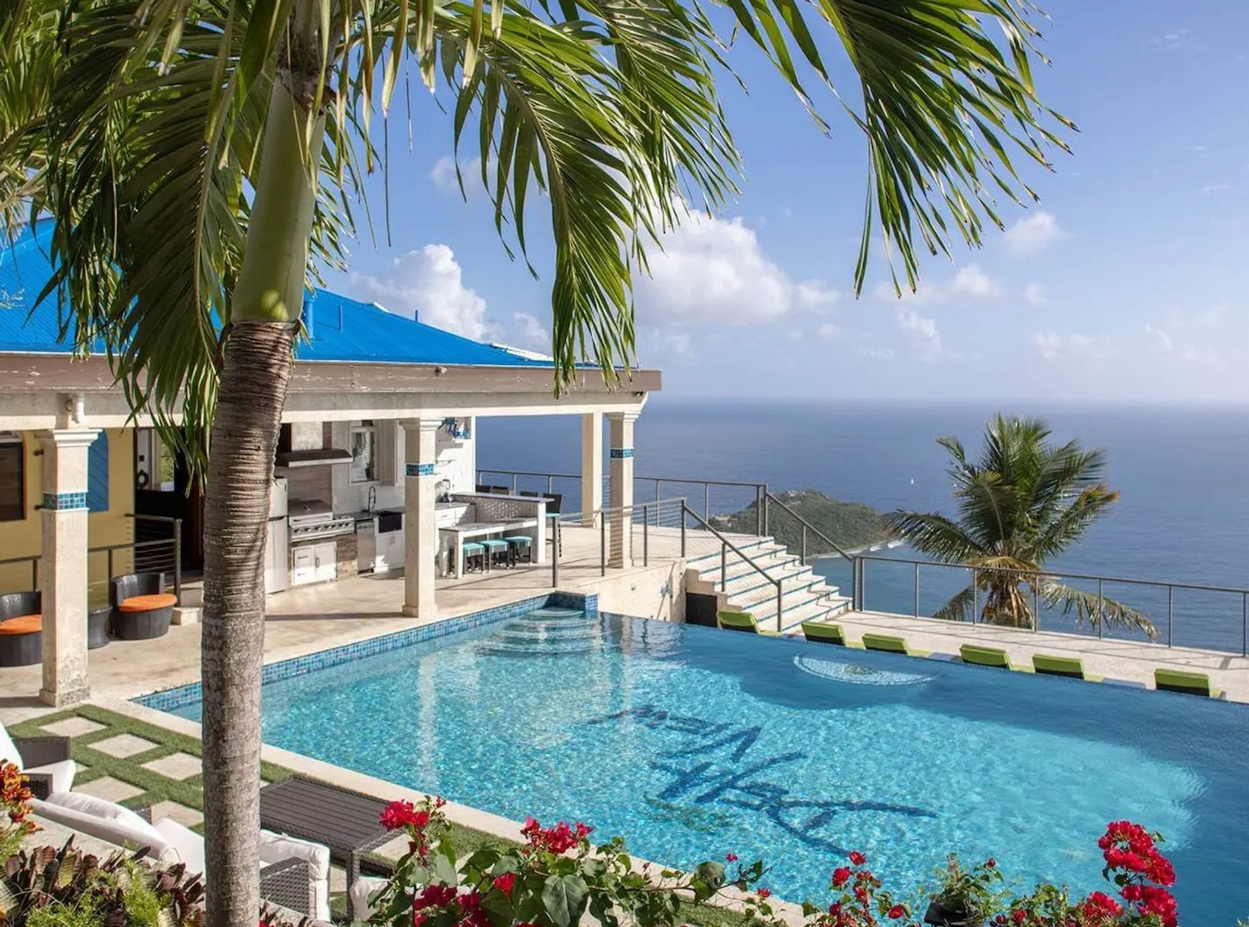 A furnished terrace sits adjacent to the swimming pool