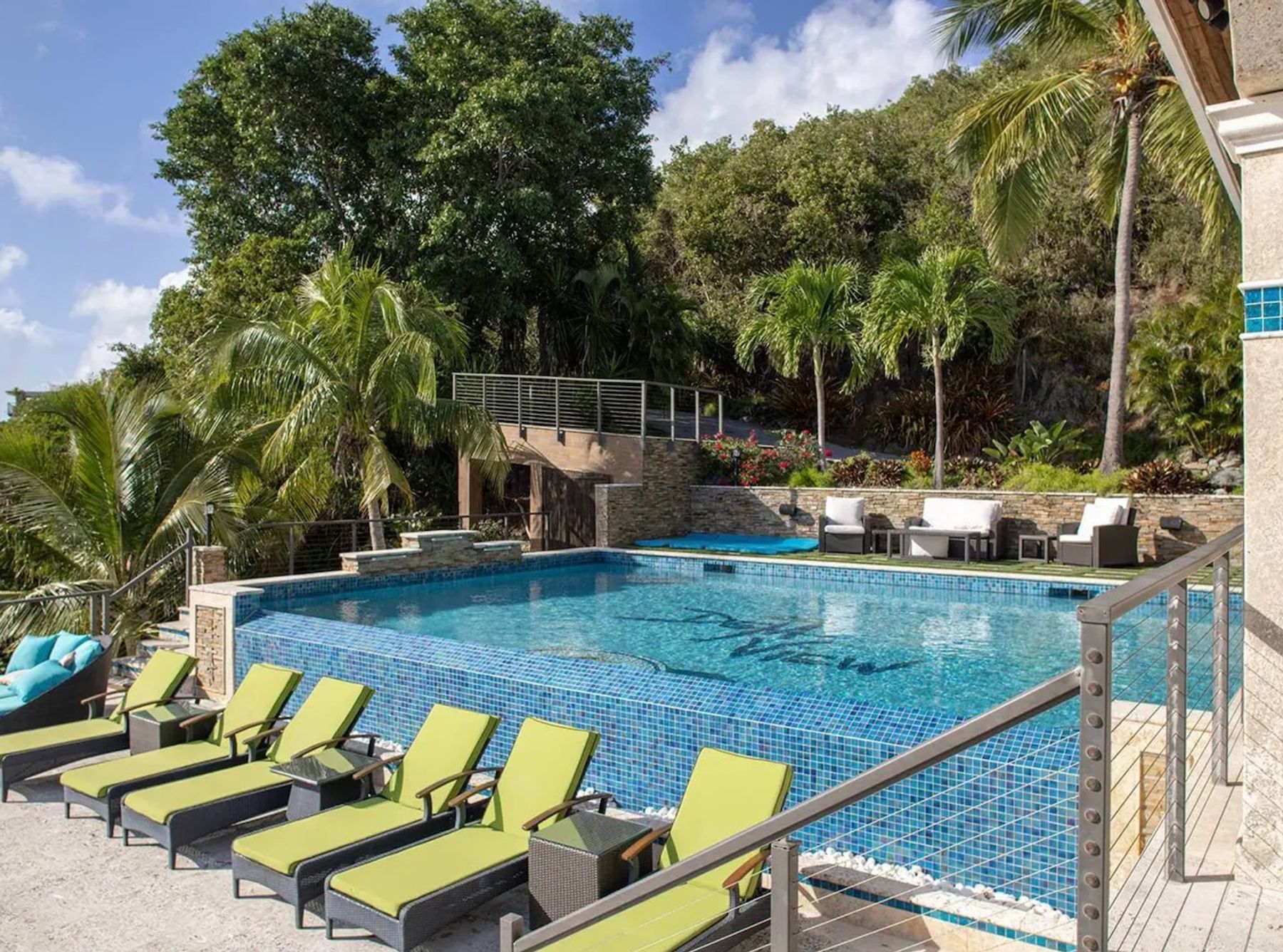 Loungers sit adjacent to the pool