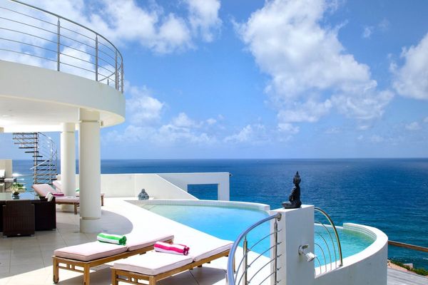Relax by the pool and enjoy the ocean view at Sky Blue