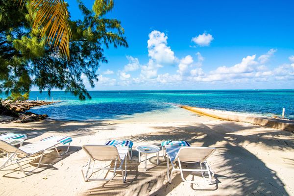 Fingertip villa is located beachfront in exclusive Cayman Kai