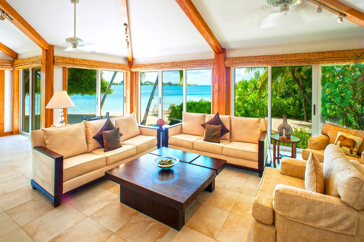 Floor to ceiling glass windows surround the living area