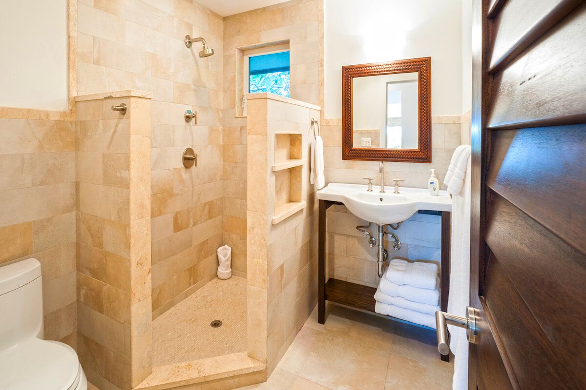 Bathroom with single vanity and shower