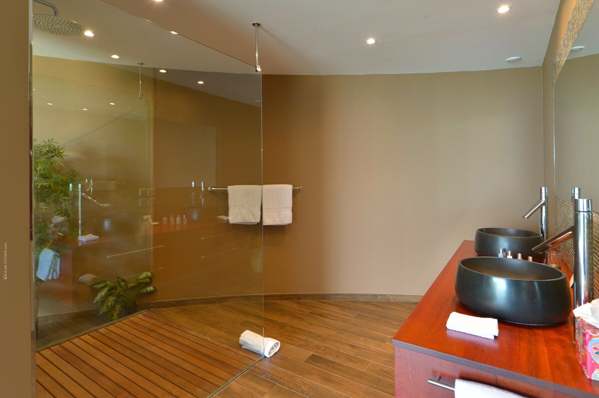 En suite bathroom with a double vanity and shower