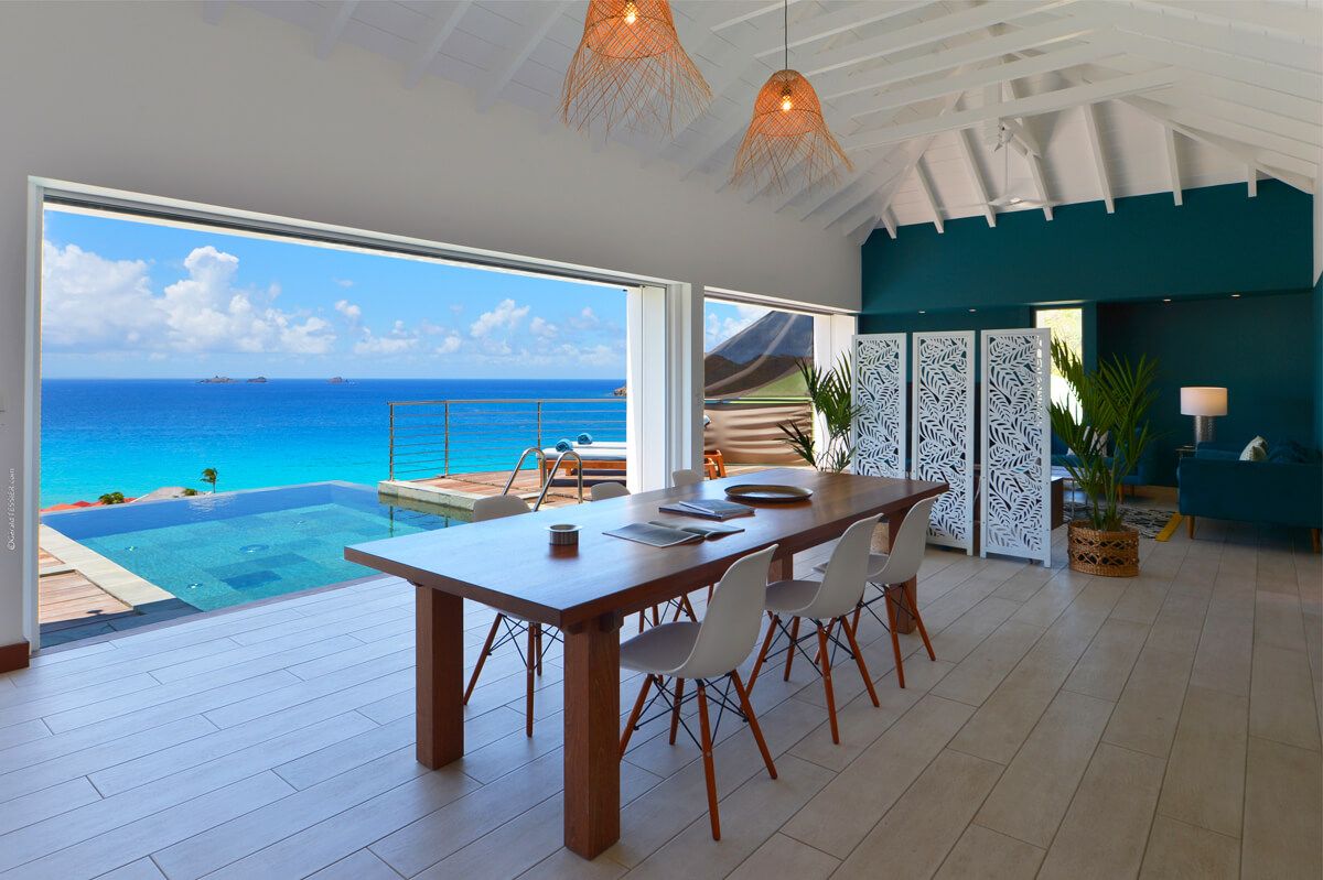 Dining table with ocean views seats six people