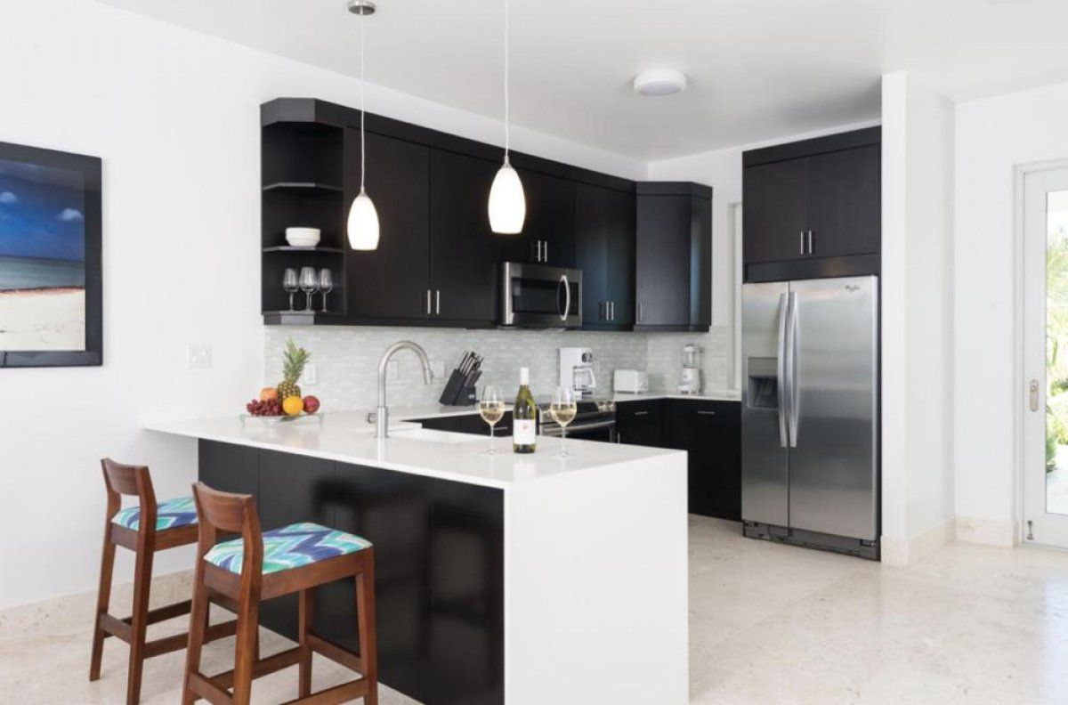 The kitchen is very efficient and has a breakfast bar that seats two people