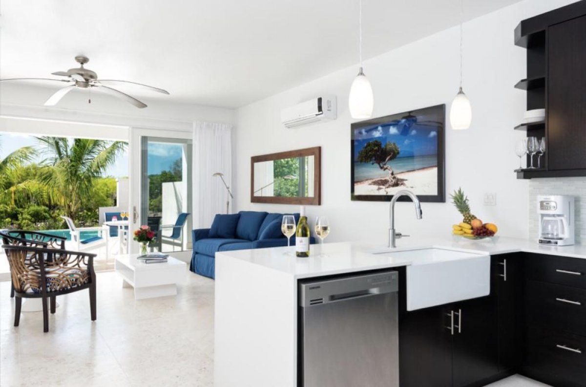 The open floor plan combines the living and the kitchen areas