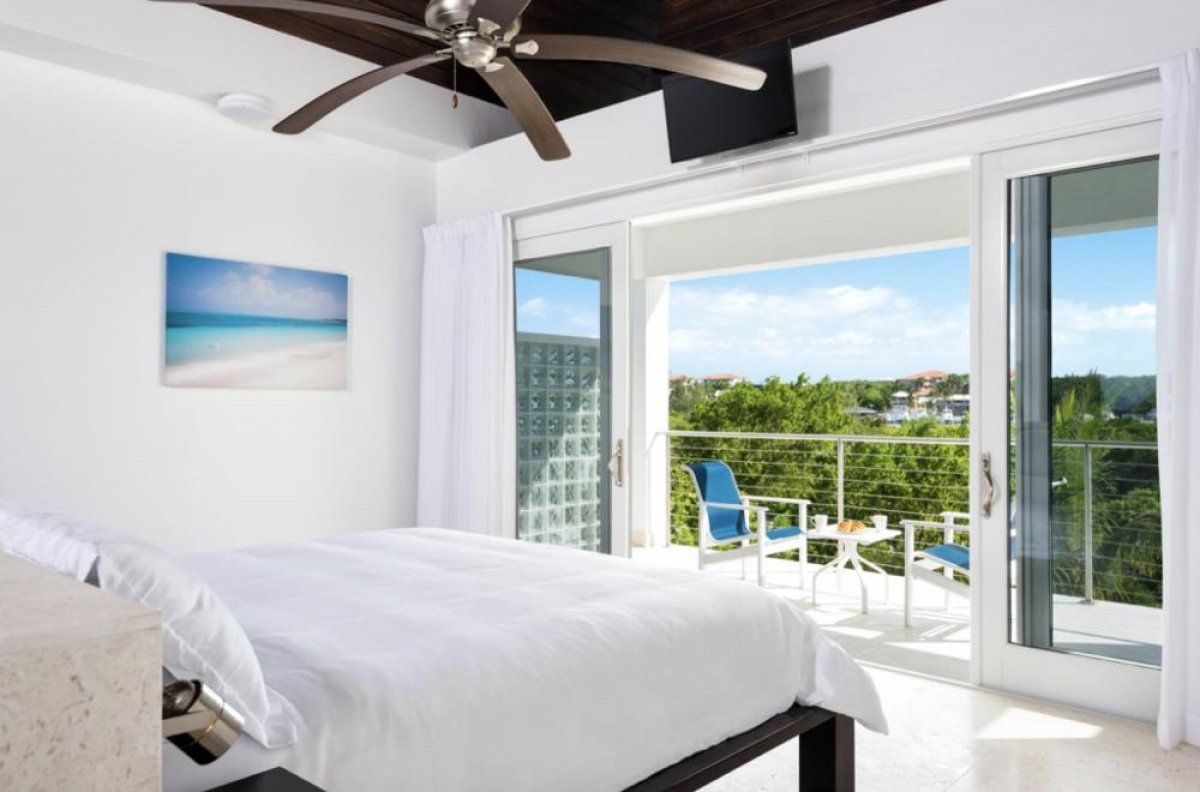 The bedroom is on the upper level and has a private balcony