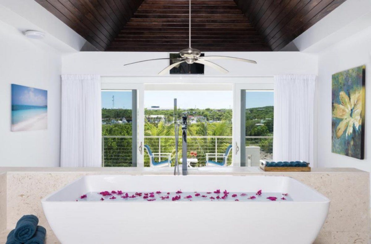 The bath tub is elevated to maximize ocean  views 
