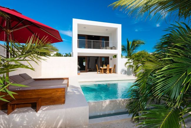 Sugar Cube Villa sits directly on Grace Bay Beach 