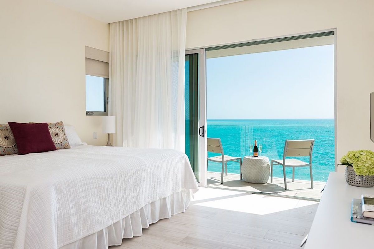 Sliding doors open to the patio in this bedroom