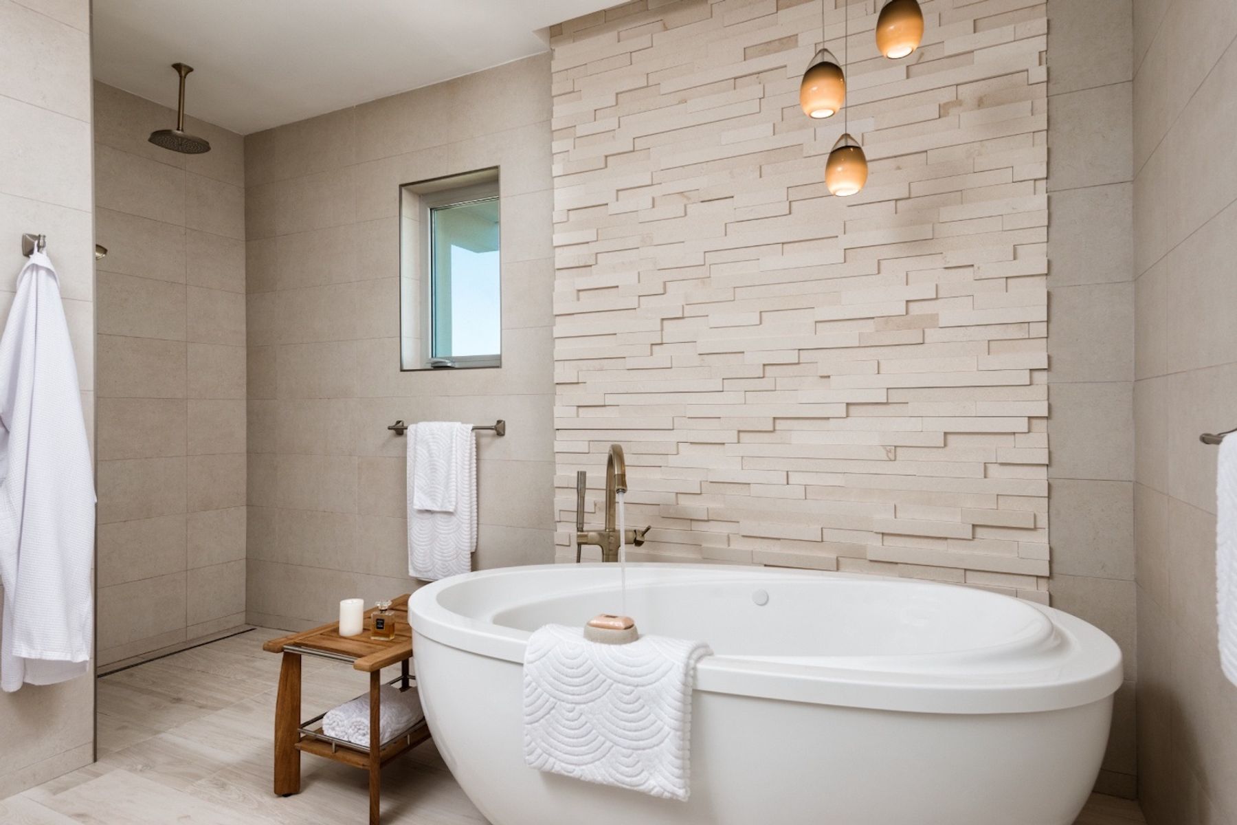 A luxurious soaking bath tub and rain head shower in the master bath room